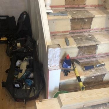 Lower newel post preparation and reinforcement