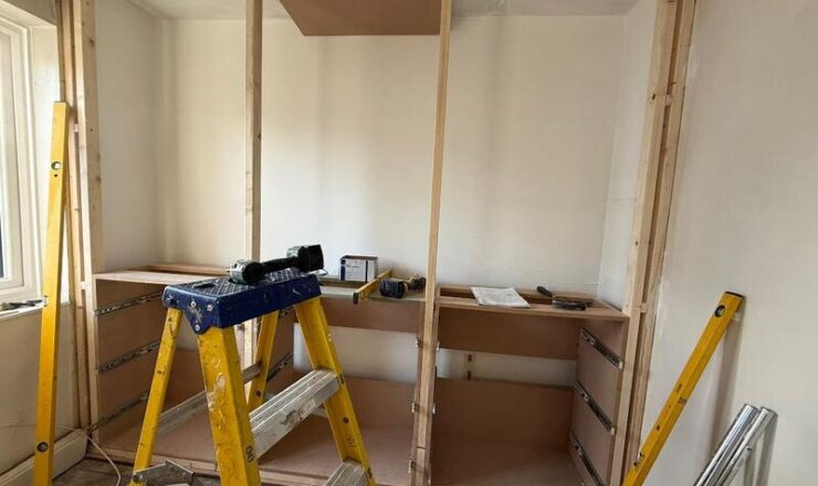 Fitted wardrobe frame and carcass build in a wall recess in Dalston.