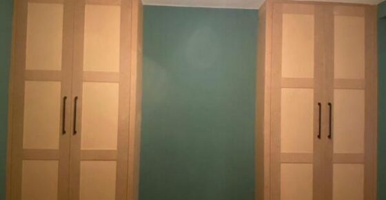 Pair of matching fitted wardrobes installed either side of wall in Loughton with modern shaker finish.