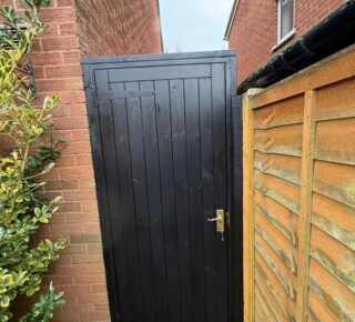 Completed black side gate installation in Chingford with secure hardware and neat frame.