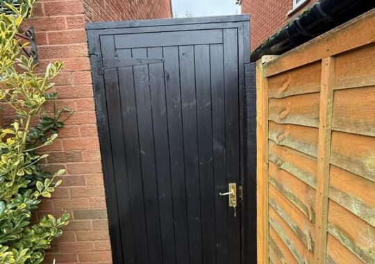 Completed black side gate installation in Chingford with secure hardware and neat frame.