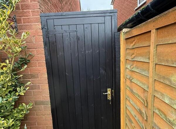 Completed black side gate installation in Chingford with secure hardware and neat frame.