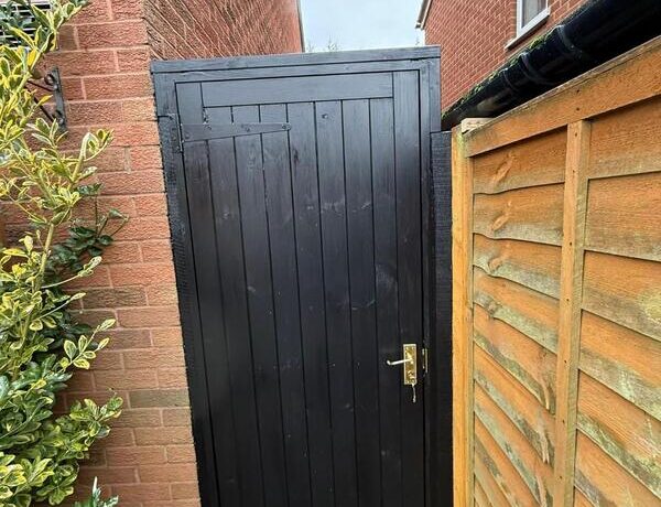 Completed black side gate installation in Chingford with secure hardware and neat frame.